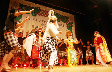 Students performing a dance onstage.