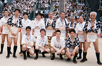 Group photo of students and locals taking part in the traditional Yamakasa festival.